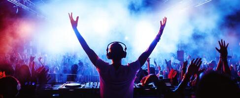 The DJ captivating the crowd with vibrant lights and energetic music. photo
