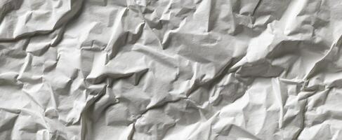 The intricate texture of crumpled white paper for creative backgrounds and designs. photo