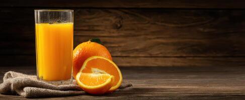 The refreshing glass of orange juice with whole and sliced fruits. photo