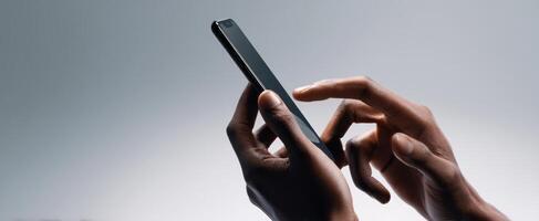 The close-up view of hands interacting with a smartphone device. photo