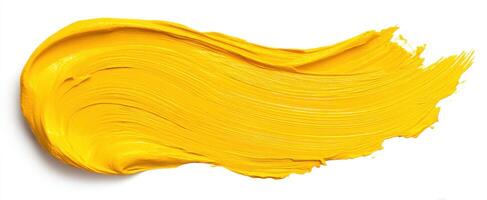 The vibrant yellow paint stroke showcasing artistic creativity and texture. photo