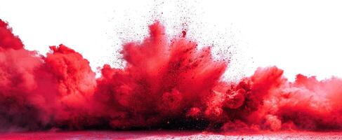 The dynamic explosion of red powder creating an artistic and vibrant backdrop. photo