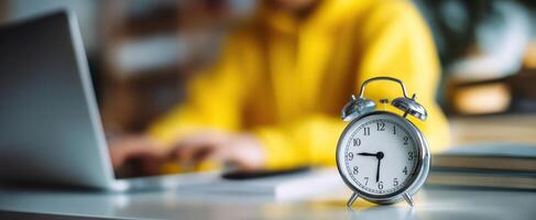 The alarm clock setting the pace for productive work sessions at home. photo