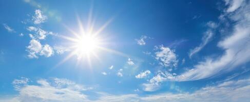 The sun shines brightly over a blue sky photo