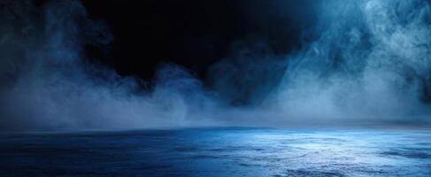 The ethereal blue mist enveloping a tranquil and mysterious landscape. photo