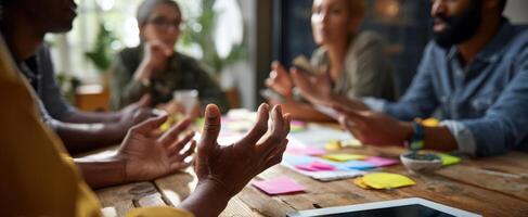 The engaged team collaborating over ideas at a modern workspace table. photo