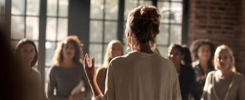 The speaker engaging a group of women in a dynamic and empowering conversation. photo