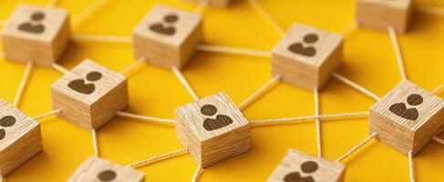 The interconnected wooden blocks symbolizing social network and collaboration. photo