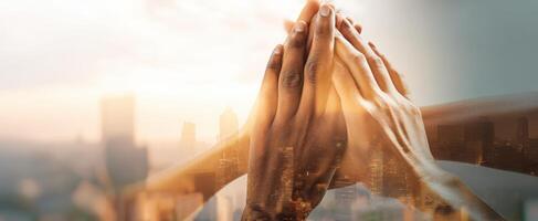 The Hands of Unity Reaching for Success in a City Landscape photo