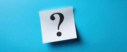 Question mark on blue background photo
