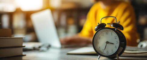 The stylish alarm clock emphasizing time management in a productive workspace photo
