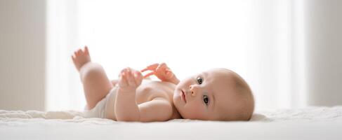 The adorable baby enjoying a peaceful moment in a bright indoor setting. photo