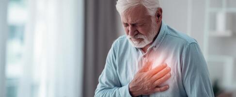 The elderly man experiencing heart pain in a domestic setting. photo