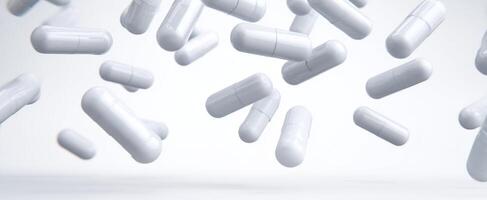 The floating white capsules representing health and wellness in modern medicine. photo
