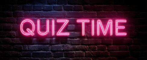 The vibrant neon sign announcing quiz time on a brick wall. photo