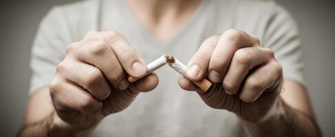 The decisive moment of breaking a cigarette to quit smoking photo