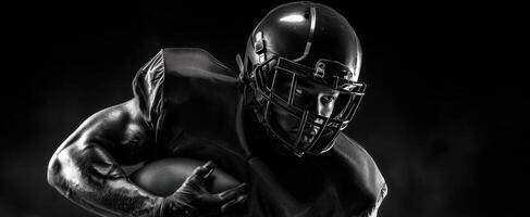 The Modern Football Player in Action Under Dramatic Lighting photo