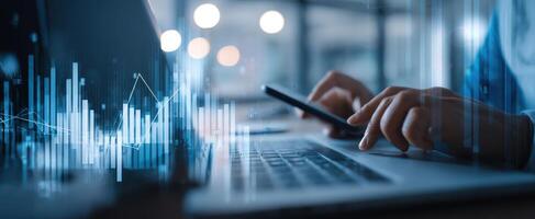 The smartphone and laptop showcasing financial analytics in a modern workspace. photo
