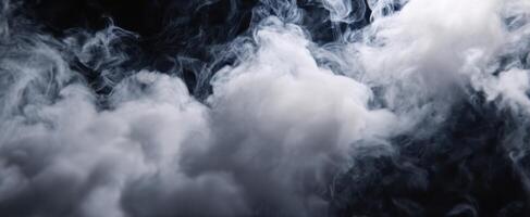 White smoke is seen in the air on a black background photo