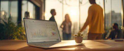 The laptop showcasing analytics in a lively modern workspace atmosphere. photo