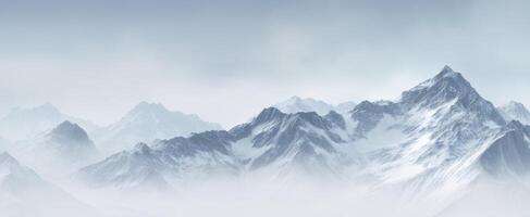 The Majestic Snow-Capped Mountains Shrouded in Mist and Fog photo