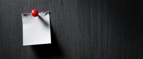 The blank note paper pinned to a textured surface for creative ideas and reminders. photo