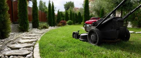 The vibrant lawn mower ready for a perfect garden maintenance session. photo