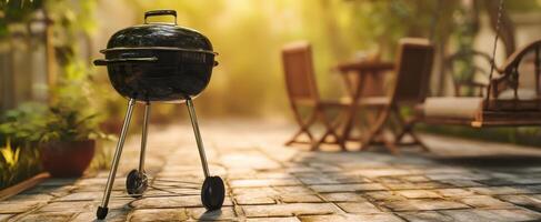 The classic charcoal grill ready for summer gatherings and outdoor cooking. photo