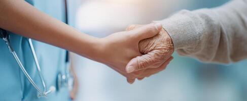 The compassionate connection between a caregiver and an elderly patient. photo