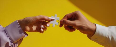 The hands connecting through a puzzle piece symbolizing unity and collaboration. photo