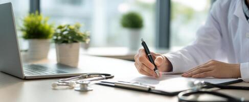 The doctor signing documents in a modern healthcare workspace. photo