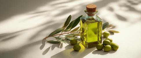 The Olive Oil Bottle Surrounded by Fresh Olives and Leaves Under Soft Light photo
