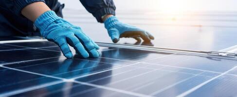 The technician installing solar panels on a rooftop with care and precision. photo