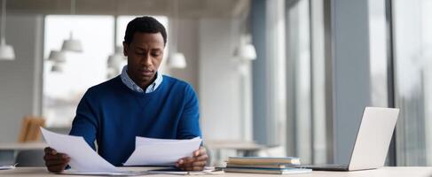 The businessman reviewing important documents at a modern workspace. photo