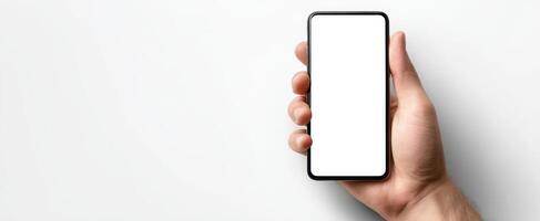 The smartphone held in a hand showcasing a blank screen for design purposes. photo