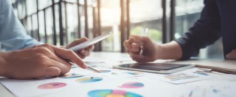 The collaboration of hands analyzing data and charts in a modern workspace photo