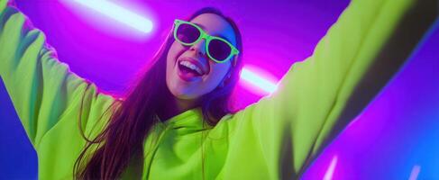 The joyful young woman in neon attire under vibrant party lights. photo