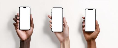 The collection of smartphones held in diverse hands against a minimalist background. photo