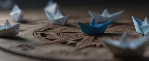 The Paper Boats Sailing on a Wooden Compass Background photo