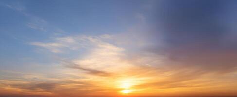 The beautiful sunset over a serene landscape with vibrant colors in the sky. photo