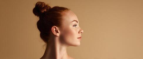 The Profile of a Beautiful Woman Illuminated by Soft Studio Light photo