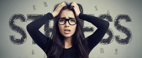 The young woman expressing stress and anxiety with a worried look on her face. photo