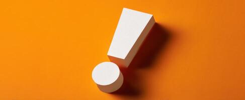 The unique exclamation mark in a vibrant orange studio setting. photo