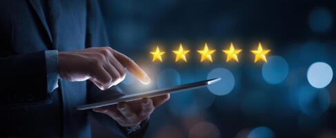 The Businessman Interacting with Digital Five-Star Rating on Tablet Device. photo