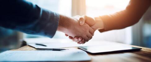 The handshake representing a successful business agreement between two professionals. photo