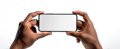 The empty smartphone held in hands against a clean white background. photo