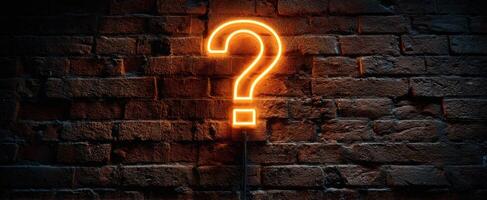 The Neon Question Mark Illuminating a Rustic Brick Wall photo