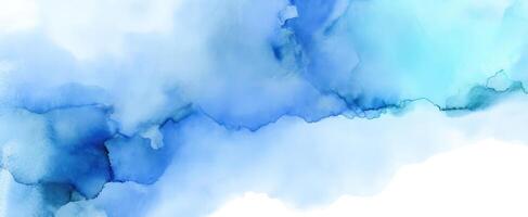 The abstract blue watercolor texture creating a calming artistic background. photo