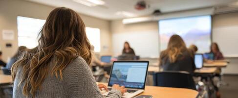 The student engaged in learning during a modern classroom presentation. photo