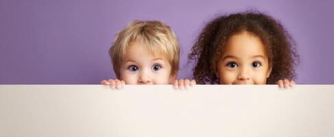 The joyful expression of children peeking behind a blank sign in a playful setting. photo